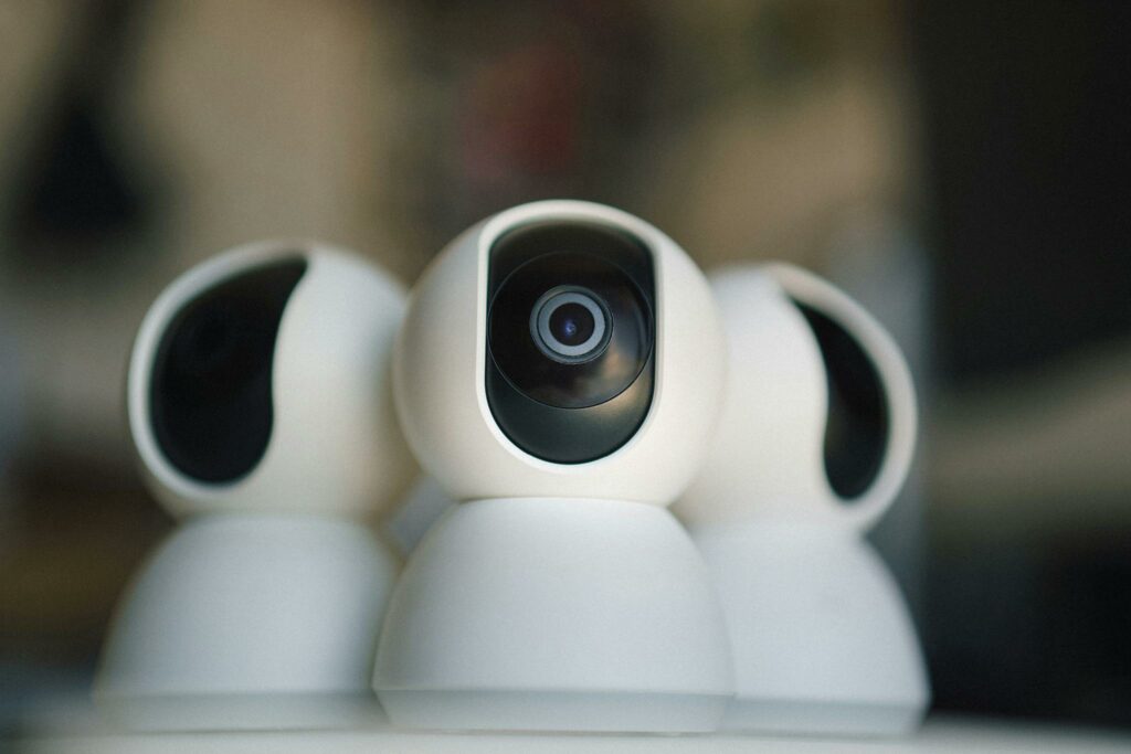 Close-up of sleek security cameras ensuring safety and privacy in indoor settings.